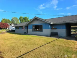 Walkway between home and garage leads you to your back yard.