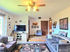 Stone entry way & the drop down living room reminds you this home was built in 1972. She's holding up nicely!