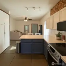 Kitchen looking out to the family room.