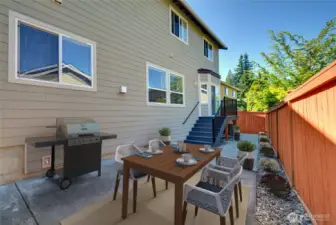 Oh the backyard!  Enjoy the sunny summer days on the patio!  Low maintenance yard is wonderful!  Newer fence with a gate on each side!