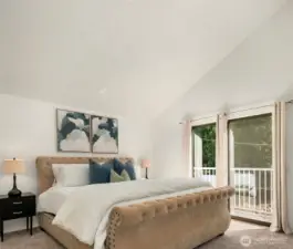 The primary has a deserving vaulted ceiling, natural light and Juliet balcony with western views.