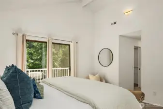 To the right, a walk-in closet and ensuite bath are provided.