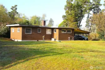 Rear view of the home with --