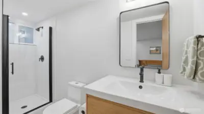 Convenient lower-level 3/4 bath perfect for guests, complete with updated finishes.