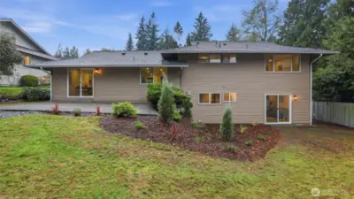 Thoughtful landscaping surrounds the spacious patio