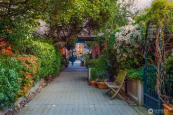 Take a stroll through the garden and courtyard, past the fountains, to the private gate leading to Post Alley