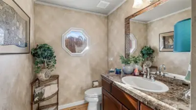 Conveniently located lower-level bath with stylish finishes.