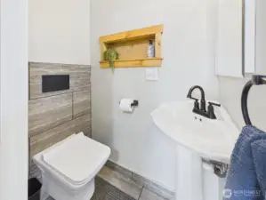 Swiss Madison Toilet in the half bath is genius.  The tank is in the wall.  Super efficient and creative.