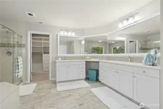 Double sinks in primary suite bath.