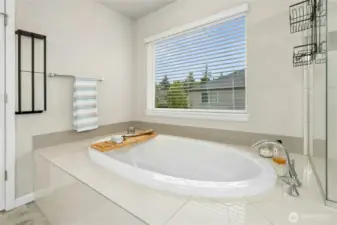 Soaking tub in primary suite bath
