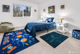 Upper level bedroom with closet built-ins.
