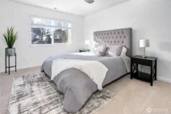 Upper level bedroom with closet built-ins.