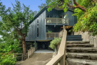 Enter the main floor via beautiful a stone stairwell