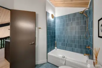 Porcelain Daltile shower & floors in hall bath