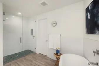 Separate tiled shower next to the spacious walk-in closet.