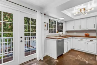 Kitchen offers French doors out to the front balcony