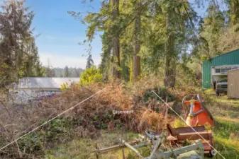 Access easement is on the left side. Garage and equipment are NOT part of this property.