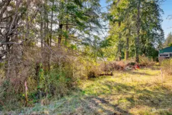 Enter property through access easement marked with stakes.