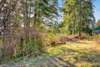 Enter property through access easement marked with stakes.