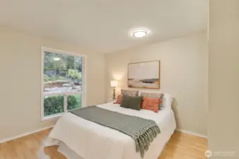 Two additional lower level bedrooms share a full bath.