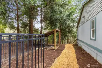 Fenced dog or chicken run is a safe haven for your beloved pets.