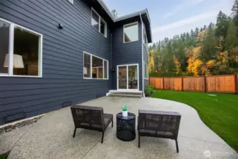 Fully fenced backyard with extended patio