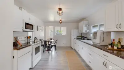 This spacious, open kitchen offers plenty of cabinet space for all your storage needs!