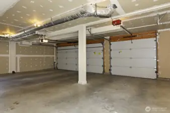 Three car garage with alley access.