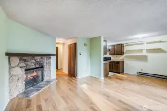 Laminate wood floors provide a warm setting for the inviting space.