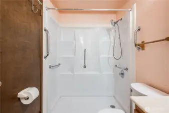Ideal for those who don't want to step in and out of a tub, this bathroom features a newer step-in shower.
