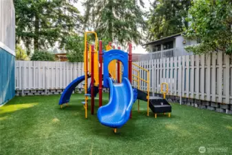 There is also a playground for the condo residents, over low-maintenance artificial grass.