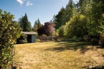 The yard’s size and privacy make it feel like your own personal park, with endless potential for recreation or relaxation. Enjoy blue berries, pear tree, and more!
