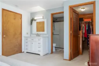Primary suite w/ walk in cedar closet and newly remodeled bathroom.Thoughtfully designed with a bedroom vanity and sink, the primary suite balances elegance and practicality, allowing seamless shared use of the space.