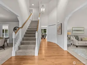Upon entering, a grand foyer greets you where you'll notice the newly refinished hardwood floors and freshly laid carpet.