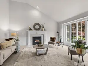 Immediately to your right is the formal living room with cozy gas fireplace.
