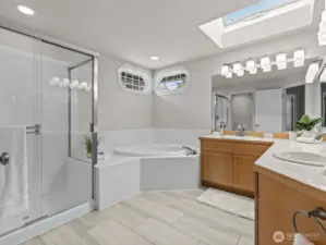 The 5 piece bathroom has a toilet closet and skylight that opens up.