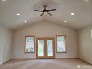 Open concept great room with Vaulted ceilings.  Walk out to covered patio.