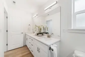 Full bathroom with dual sinks