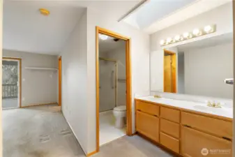 Within primary bedroom 2 vanity sink and 3/4 bathroom.