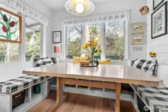 Charming breakfast nook that makes you want to stay awhile! Open a window and let the ripple of the creek and the song birds fill the air!