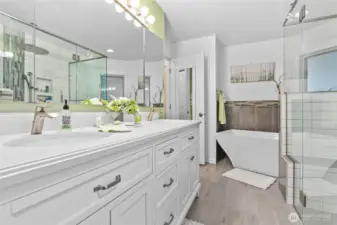 Primary Bathroom - fully remodeled - new soaker tub, glass wall shower that is wheelchair accessible, heated tile floors and a double vanity