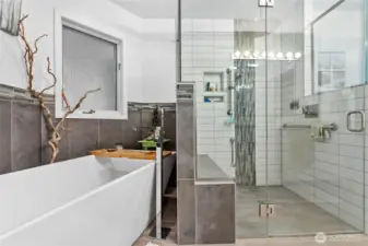 Primary Bathroom - soaker tub and glass shower that is wheelchair accessible