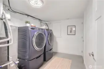 The laundry/utility room includes a new washer/dryer, new high efficiency heat pump w/ air conditioning and a new tankless water heater.