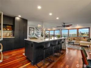 Beautifully renovated kitchen with Dark wood cabinets and gorgeous quartz countertops make this ho feel updated and classy. Cook, dine or entertain with the amazing view as a back drop.