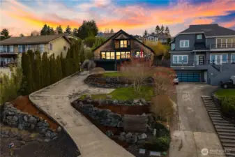 The terraced drive way makes room for several cars to park.
