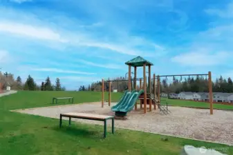 Community amenities include a well-maintained playground just steps away.