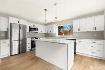 Luxury kitchen with custom cabinets, Quartz counters, SS appliances and Italian tile backsplash.