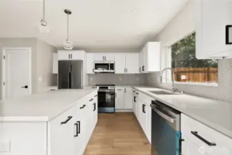 Luxury kitchen with ample storage and eating island.