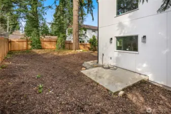Private secluded fenced yard with expansive patio perfect for entertaining.