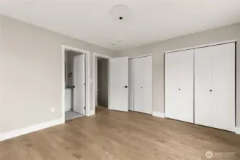 Primary suite with 8' ceilings, dual closets and en-suite bathroom.